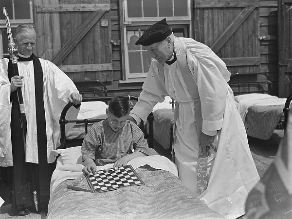Bishop of London ( Arthur Winnington-Ingram ) with one of the little patients during