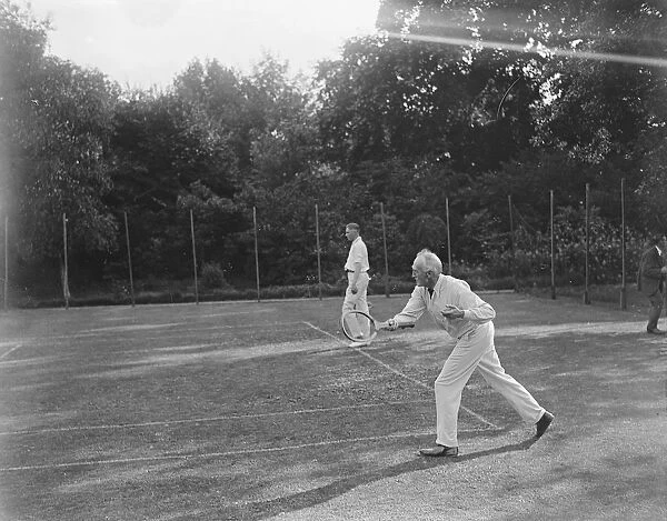 The Bishop of London plays tennis at Fulham Palace. 26 January 1922