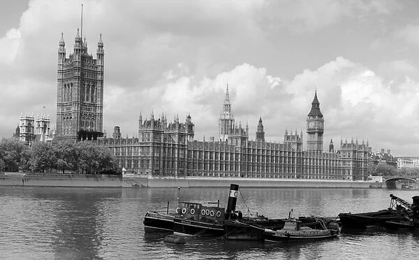 Boats on the River Thames at Houses of Parliament Building, London, England, UK
