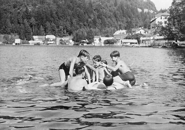 Boy king of Yugoslavia joins in the fun of camp life. King Peter, the boy monarch of Yugoslavia