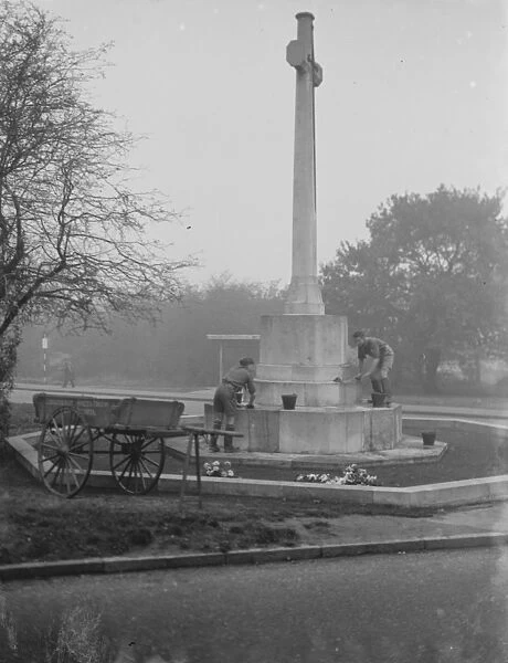 Two boy scouts clean the Chislehurst memorial, Kent. 1936