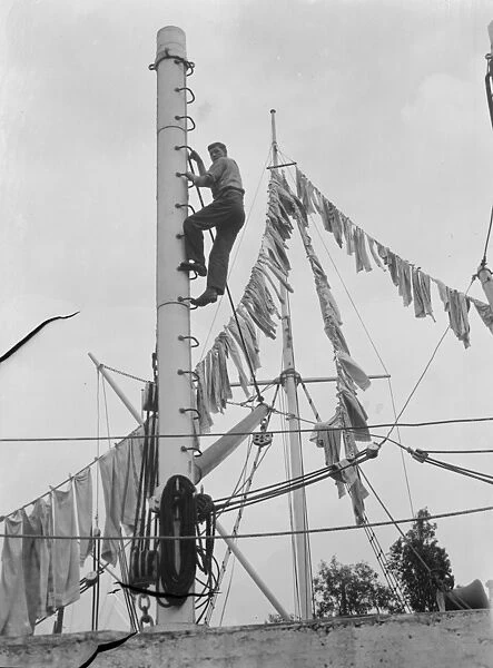 Boys from the Gravesend Sea School, Kent, drying their washing on a flag hoist