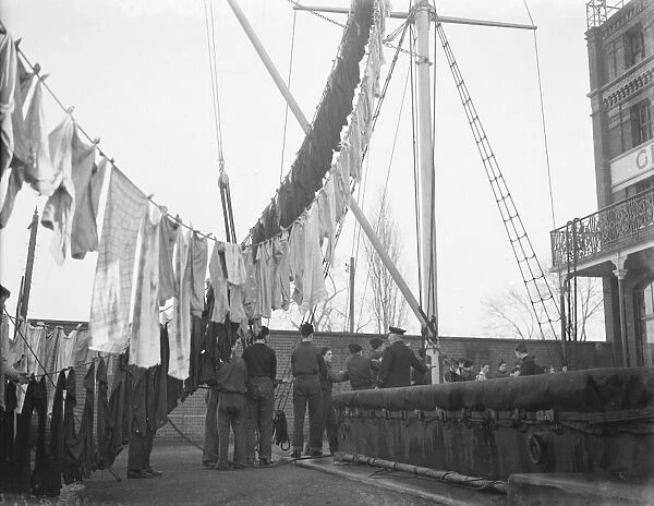 Boys from the Gravesend Sea School, Kent, hanging their washing from the rigging
