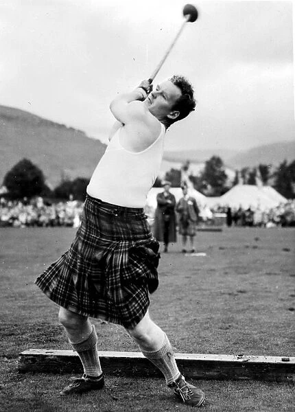 Braemar, Aberdeenshire: W. Anderson throwing the 16lbs hammer at the Annual Braemar gathering
