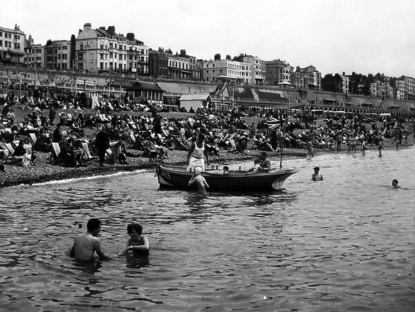 Brighton Crowded beaches and boat 1 August 1954