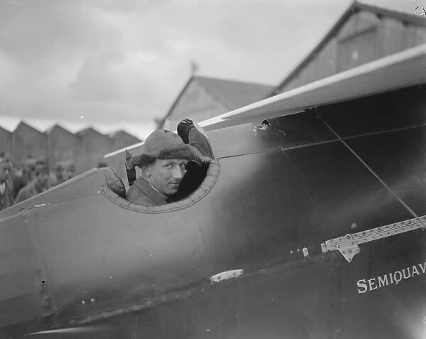 British Competitors Chance in Great Air Race Mr Raynham photographed in his machine
