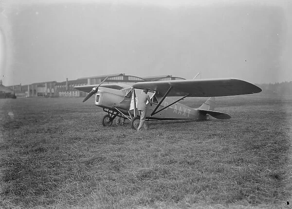 At Brooklands The Puss Moth, which has an enclosed canopy like a car 25