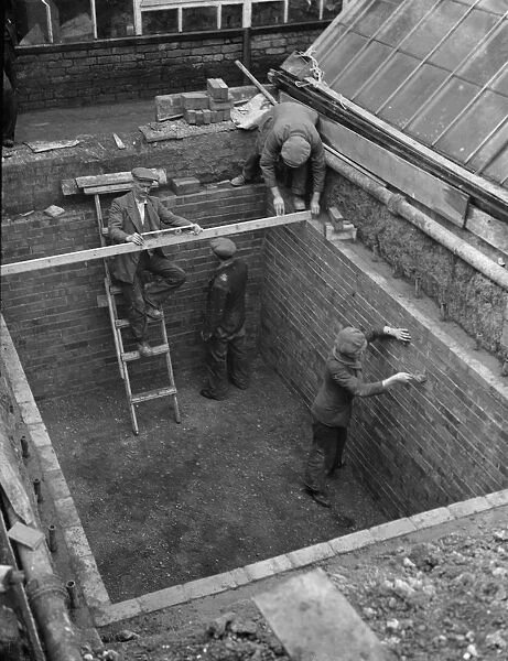 Building the outer foundations for an air raid shelter in a garden in Hextable