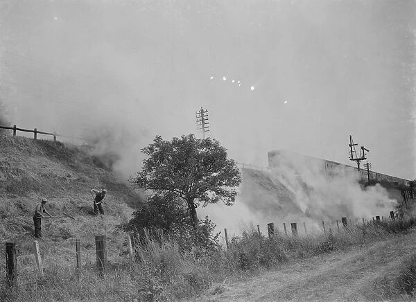 Burning grass on railway banks, Slades Green. 1937