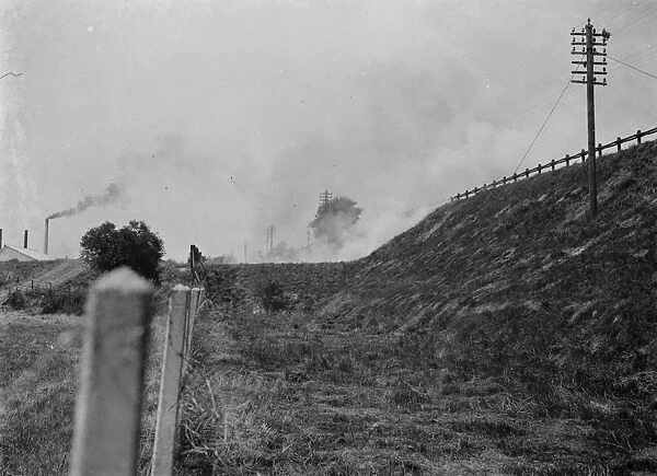 Burning grass on railway banks, Slades Green. 1937