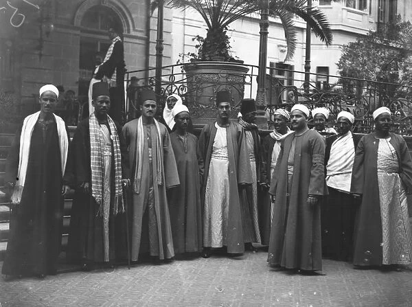 Cairo, Egypt. A picturesque group of Dragomen outside the Shepheard Hotel. February