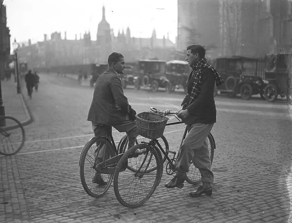 Cambridge Undergraduates chatting in the street with their bicycles. 1929