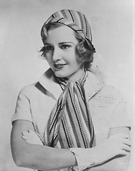 Cap and scarf to match for sports. The latest thing in sportswear worn by Madge