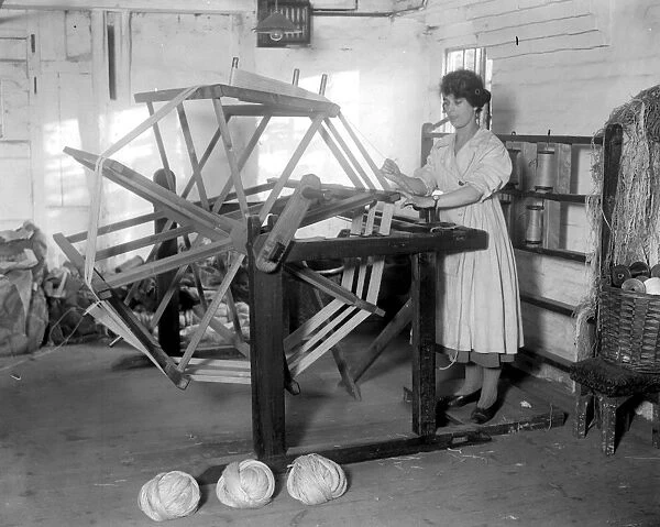 Carpet making at Wilton. The warping wheel. 1920