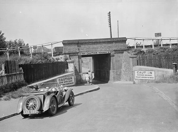 Caution signs on a narrow bridge in Crayford, Kent. 1938