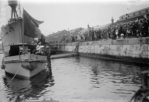 Chatham navy week. Visitors watching a naval diver about to descend. 12 August 1929
