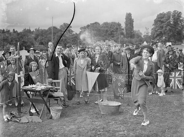 The Chelsfield fete in Kent. A women takes part in one of the side shows