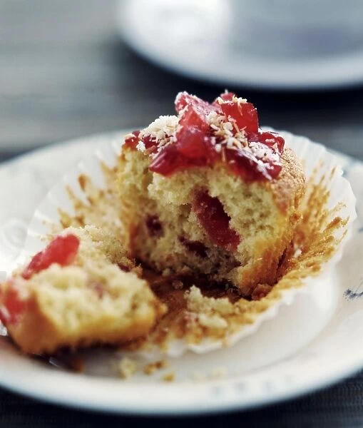 Cherry muffin broken open on white plate credit: Marie-Louise Avery  /  thePictureKitchen