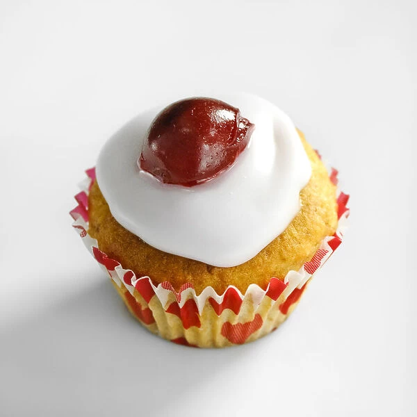 Cherry topped mini muffins on white background credit: Marie-Louise Avery  /  thePictureKitchen
