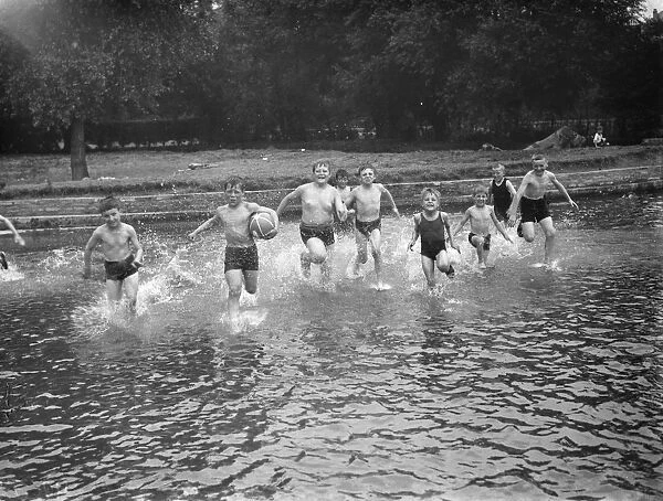 Children bath in the ponds in, Central Park Dartford. 1938