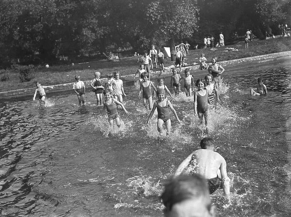 Children enjoying the paddling pool in Dartford, Kent. 1939