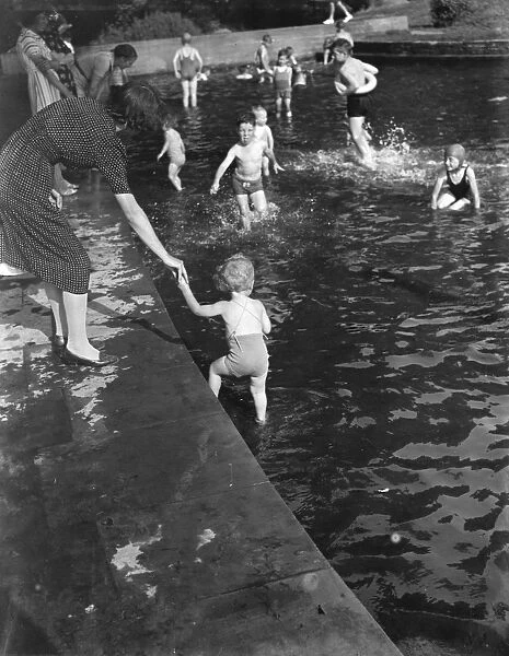 Children enjoying the paddling pool in Dartford, Kent. 1939