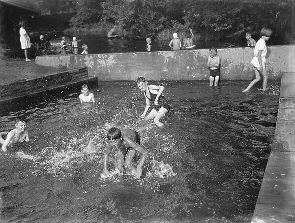 Children enjoying the paddling pool, Dartford, Kent. 1939