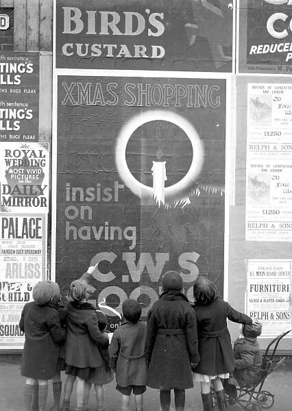 Children look up at a CWS poster. 1934