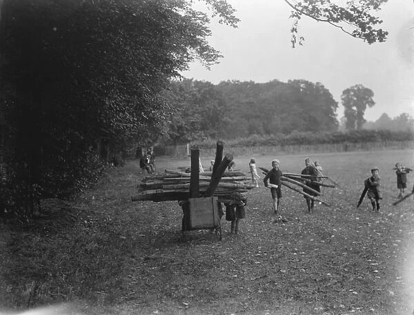Children use prams to bring firewood from the woods in Sidcup, Kent