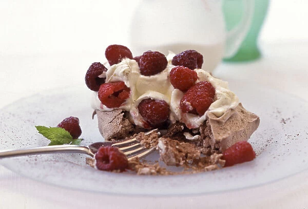 Chocolate meringue with whipped cream and fresh raspberries credit: Marie-Louise