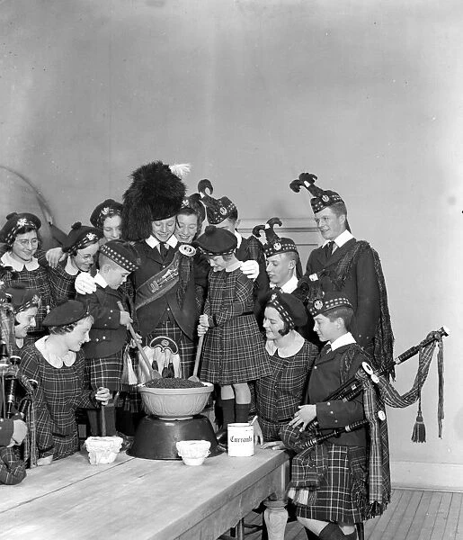 Christmas prepartations at the Royal Caledonian Schools, Bushey, mixing pudding. 15
