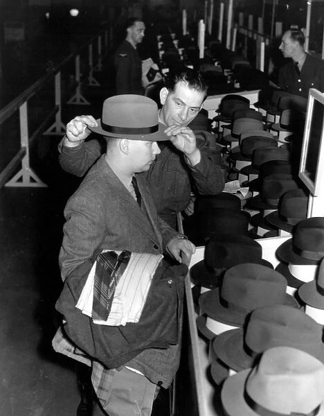 Back to civvy street : discharged British airmen select their civilian clothes
