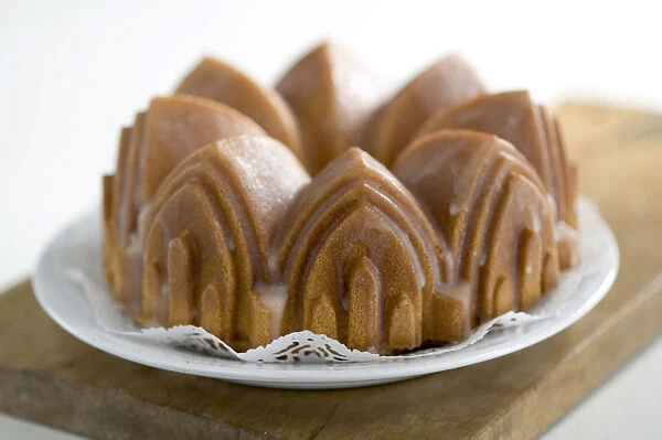 Classic pound cake baked in cathedral style Bundt tin, with sugar glaze credit