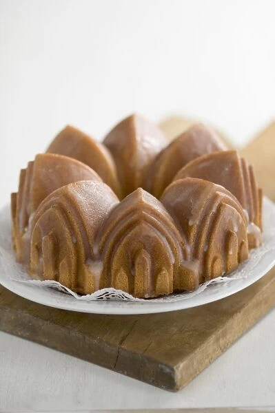 Classic pound cake baked in cathedral style Bundt tin, with sugar glaze credit