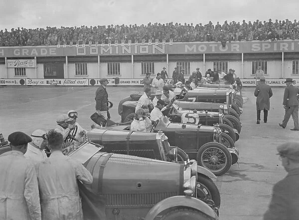 A close race at Brooklands. Crowds thronged the Brookland track for the great Easter