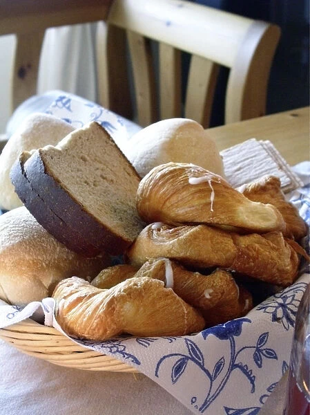 A collection of various breads and pastries in basket on table. Sweden credit
