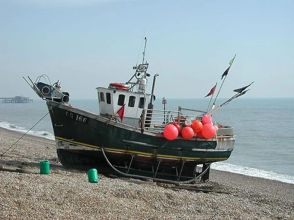 Colourful red buoys on moored fishing boat, Walmer beach, Kent, England