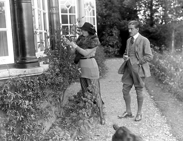 Constance, Duchess of Westminsterand Captain Lewis in the garden of her New Forest