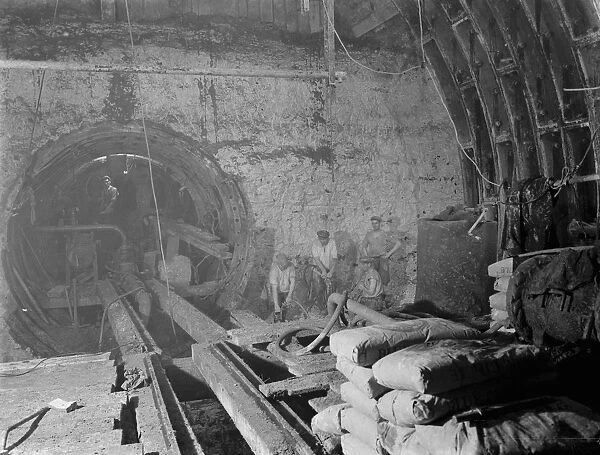 The construction of the Dartford Tunnel. Workers building the main tunneling shield