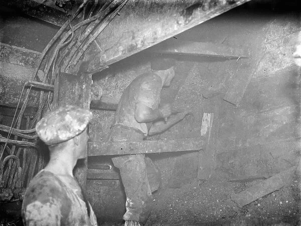 The construction of the Dartford Tunnel. A workmen cutting by the shield