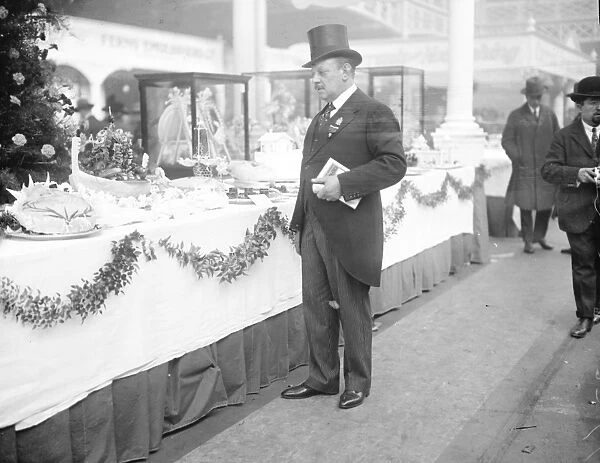 Cookery exhibition at Olympia. Mon H Cedeard, chef of the King, examining some