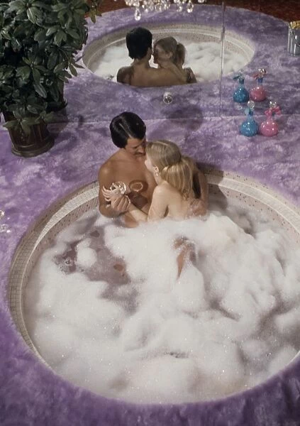 couple in hot tub 1970s funny humour cheesy bubbles valentine love couple romance
