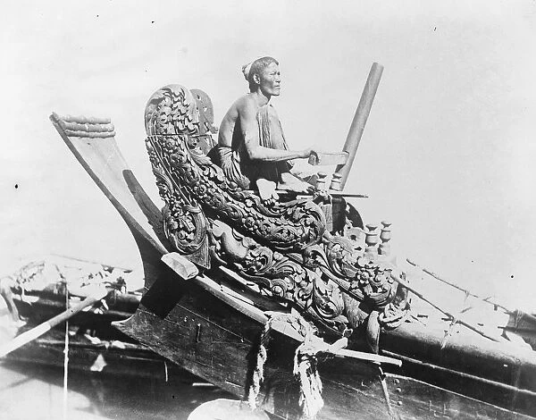 The cox of a queen craft An interesting picture from Burma, showing the steersman