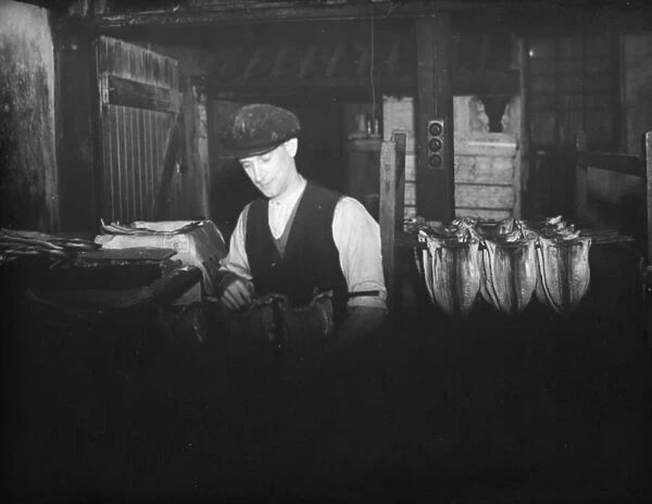 Curing fish in a limehouse in Stepney. 1936