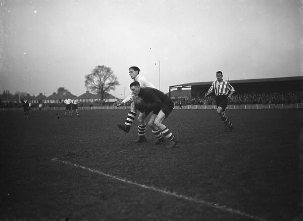 Dartford versus Leyton in the FA Cup. One of the goal keepers takes the ball