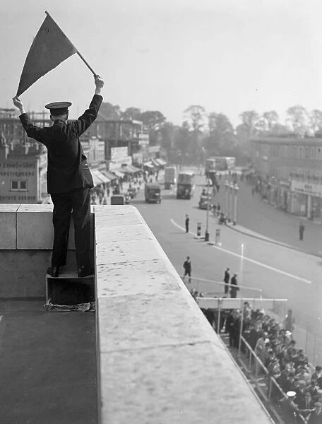 Derby Day, Epsom. A Bus Official controlling the Derby Day buses, taking the