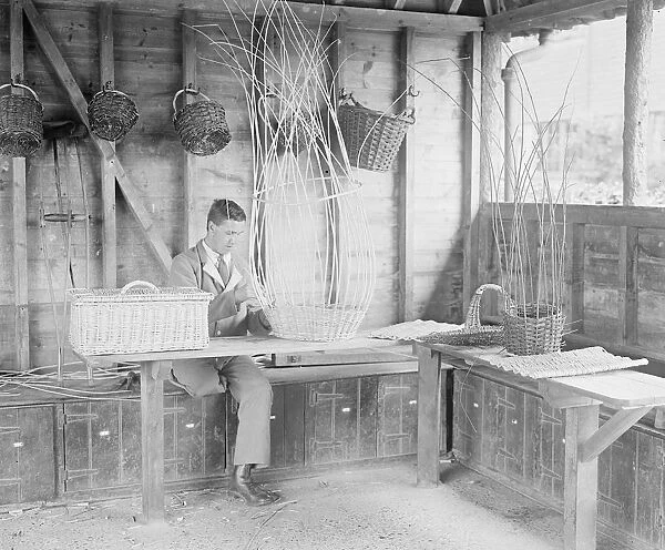 A disabled soldier basket weaving at the Princess Louise Military Orthopaedic Hospital