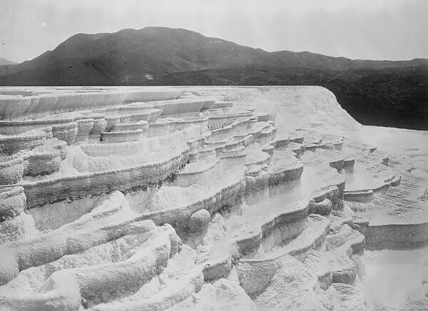 Draining a lake to uncover world famous terraces. It is believed that the famous pink