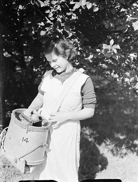 East Malling Research Station open day. Girl with a fruit bucket. 1937