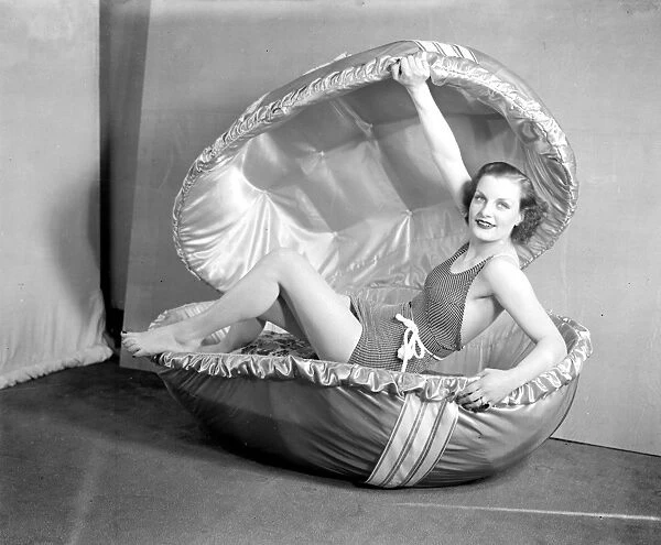 Easter, 1936. Dawn the famous Selfridge model and an outsize Easter egg. 17 March 1936